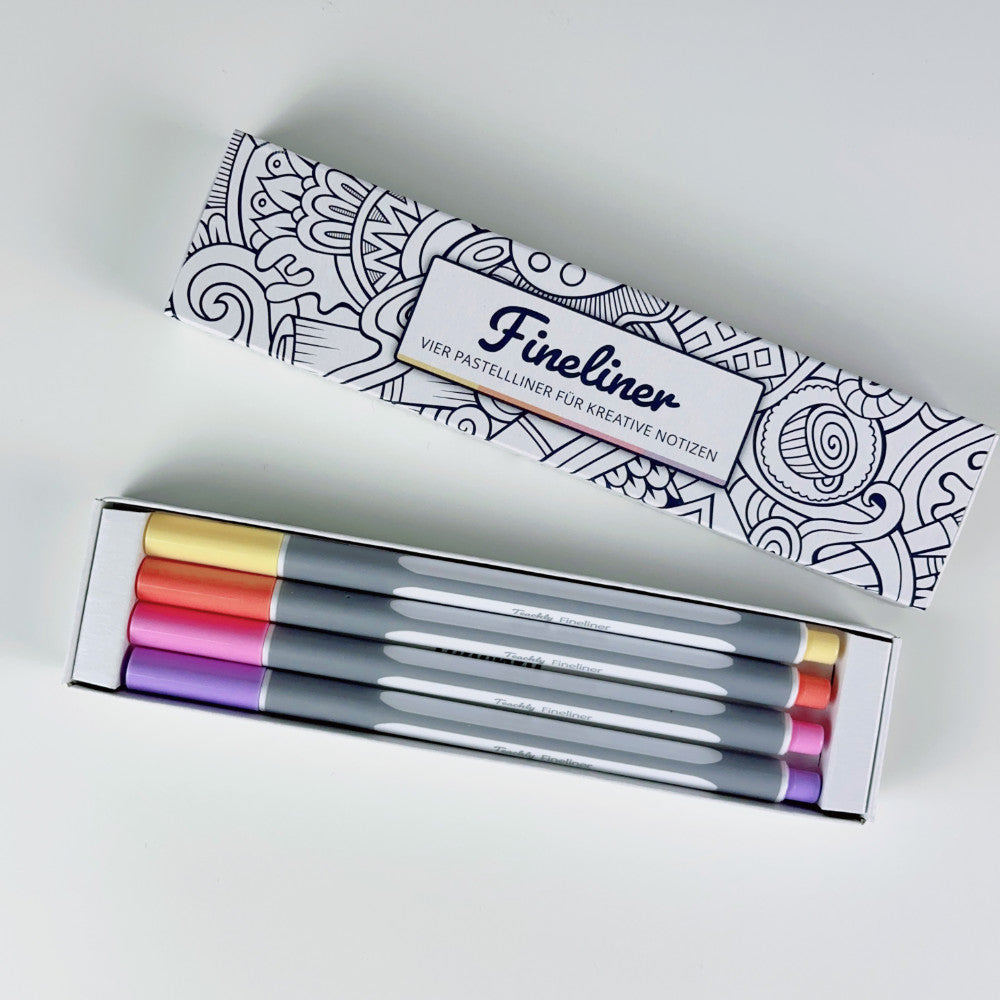 Geöffnete Teachly Fineliner Summer Verpackung mit vier Stiften in den Farben Gelb, Orange, Rosa & Violett