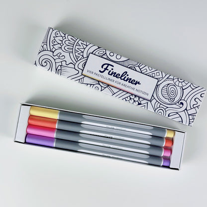 Geöffnete Teachly Fineliner Summer Verpackung mit vier Stiften in den Farben Gelb, Orange, Rosa & Violett