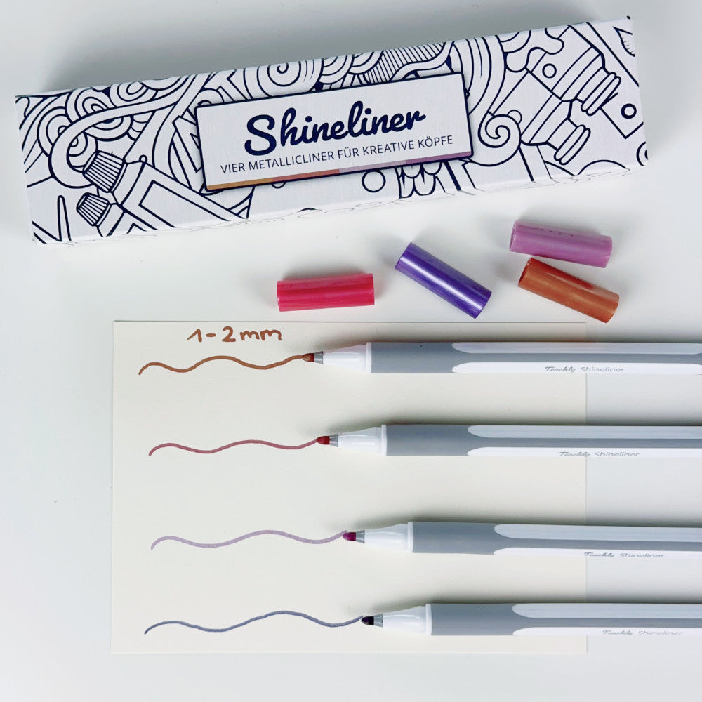 Illustration der Schreibfarbe der vier Metallic Stifte in den Farben Lila, Violett, Rot und Bronze des Teachly Shineliner Vintage Sets